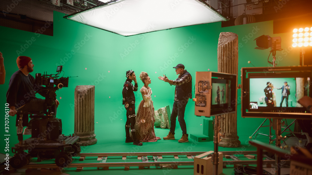 On Big Film Studio Professional Crew Shooting Period Costume Drama Movie. On Set: Director Explains 