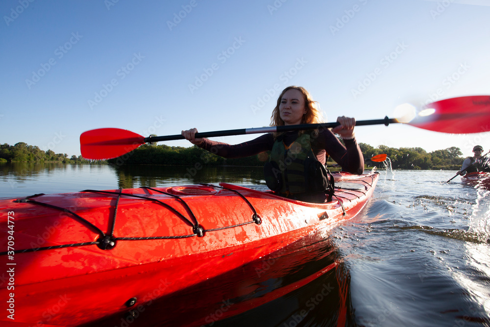 Kayaking. People paddling a kayak. Canoeing. Paddling.