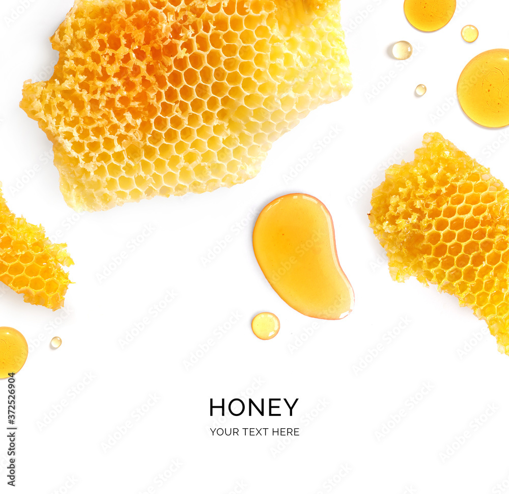 白色背景上蜂蜜制成的创意布局。平面布局。食物概念。