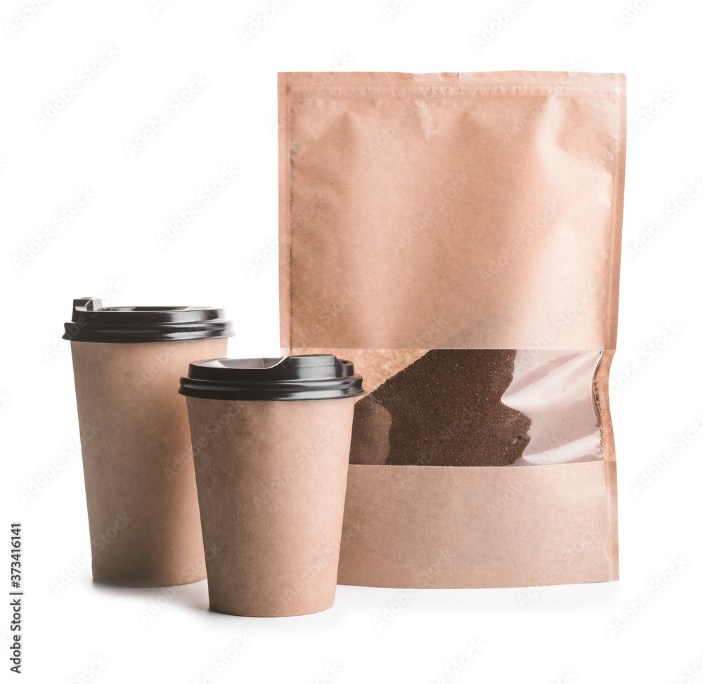 Bag with coffee powder and cups isolated on white