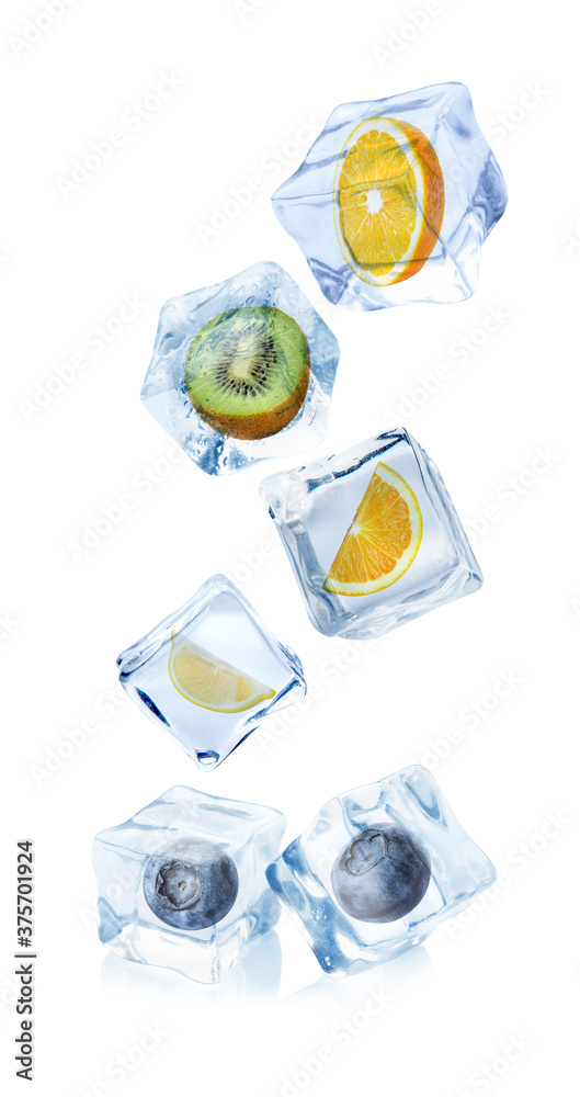 Ice cubes with different berries and fruits on white background