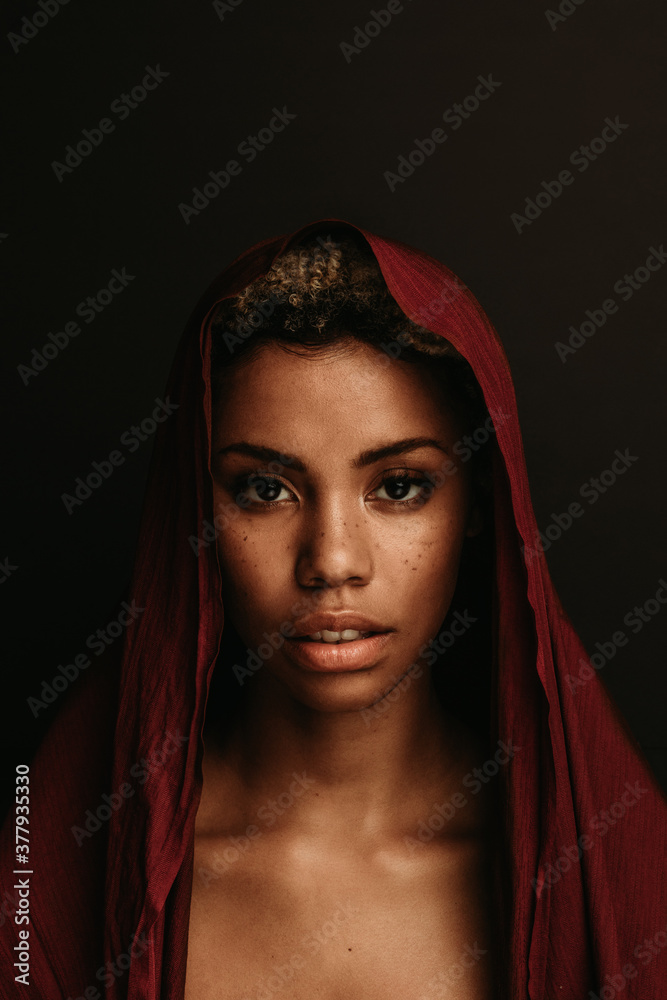Portrait of african american woman on black background