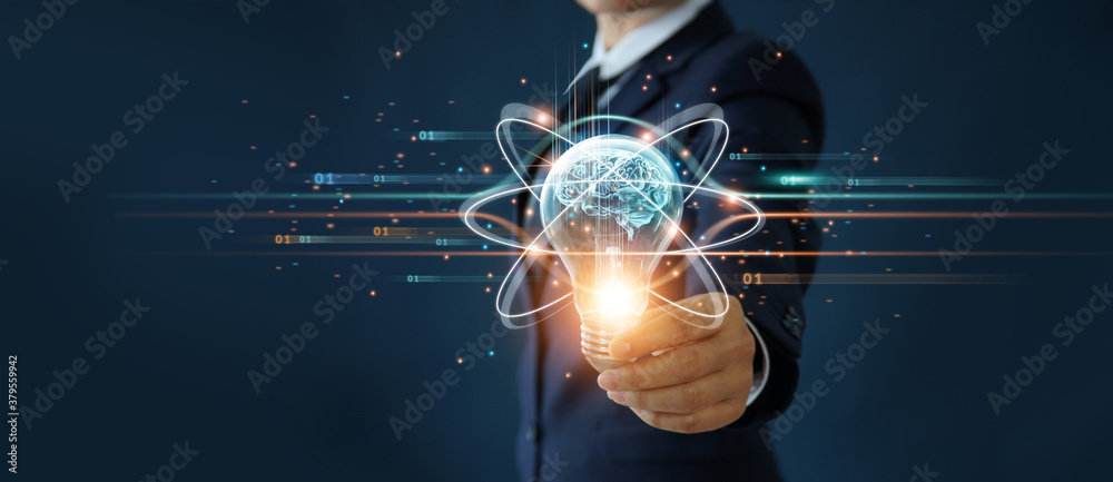 Businessman holding light bulb and brain inside, Idea and imagination, Creative and inspiration, Sci