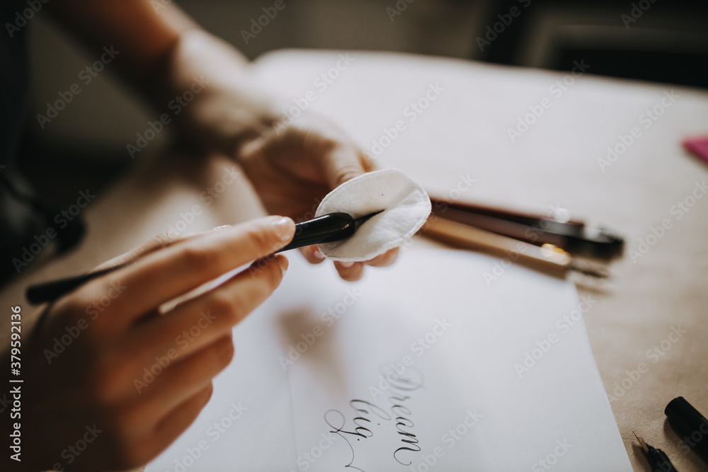 Close-up image of a calligrapher at work.