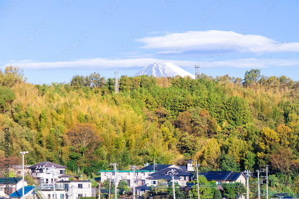 Beautiful sunny landscape of snow covered Mountain Fuji and small village,Shizuoka,Japan