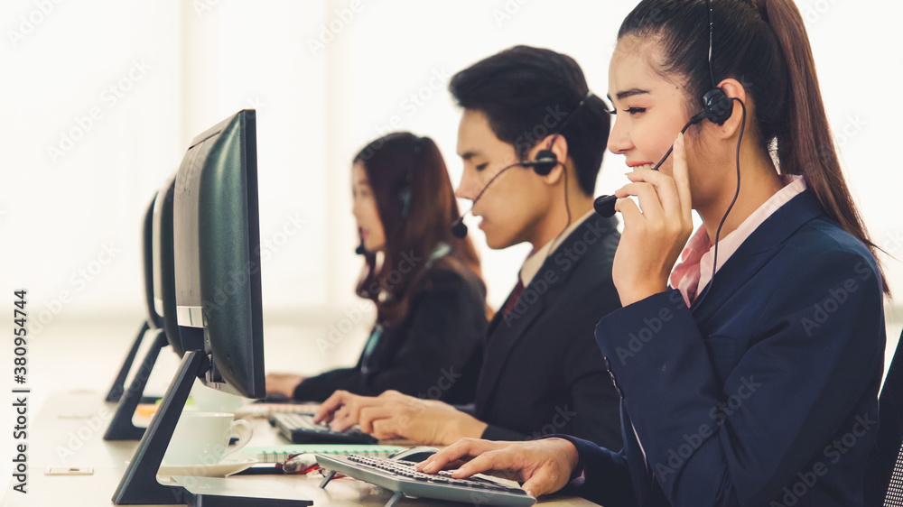 Business people wearing headset working in office to support remote customer or colleague. Call cent