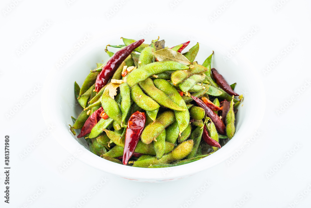 A pot of delicious spicy edamame on white background