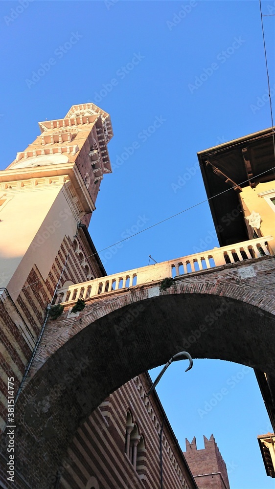 Composition in bright sunlight. Fragments of ancient italian buildings and blue sky