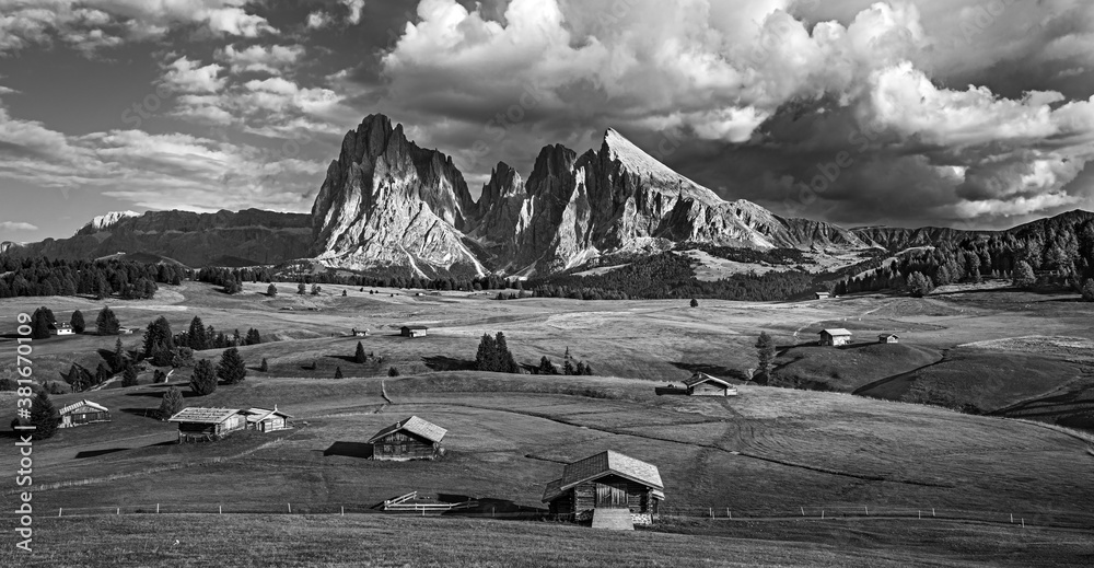 Famous Alpe di Siusi - Seiser Alm with Sassolungo - Langkofel mountain group in background at sunset