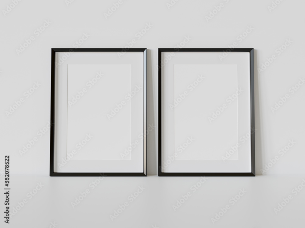 室内模型中，两个黑色框架靠在白色地板上。墙上的图片模板3D