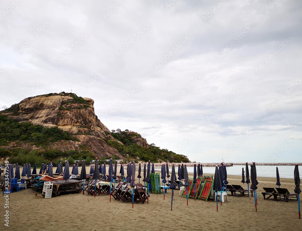 Foldable beach umbrellas and beach chairs await visitors.