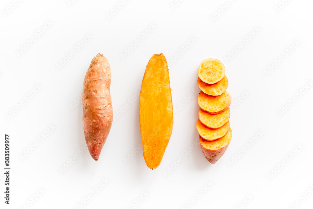 Set of whole and sliced sweet potatoes. Flat lay, top view