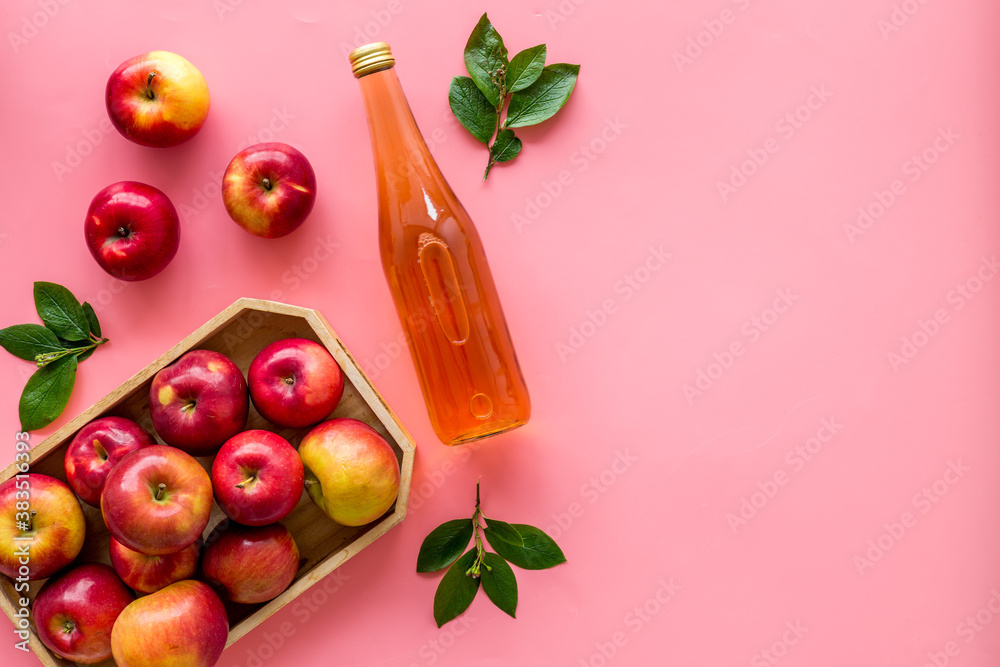 Apple cider vinegar in bottle with fruits top view