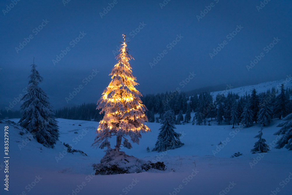 Holiday landscape with Christmas tree, snow and lights in winter mountains. New year celebration con