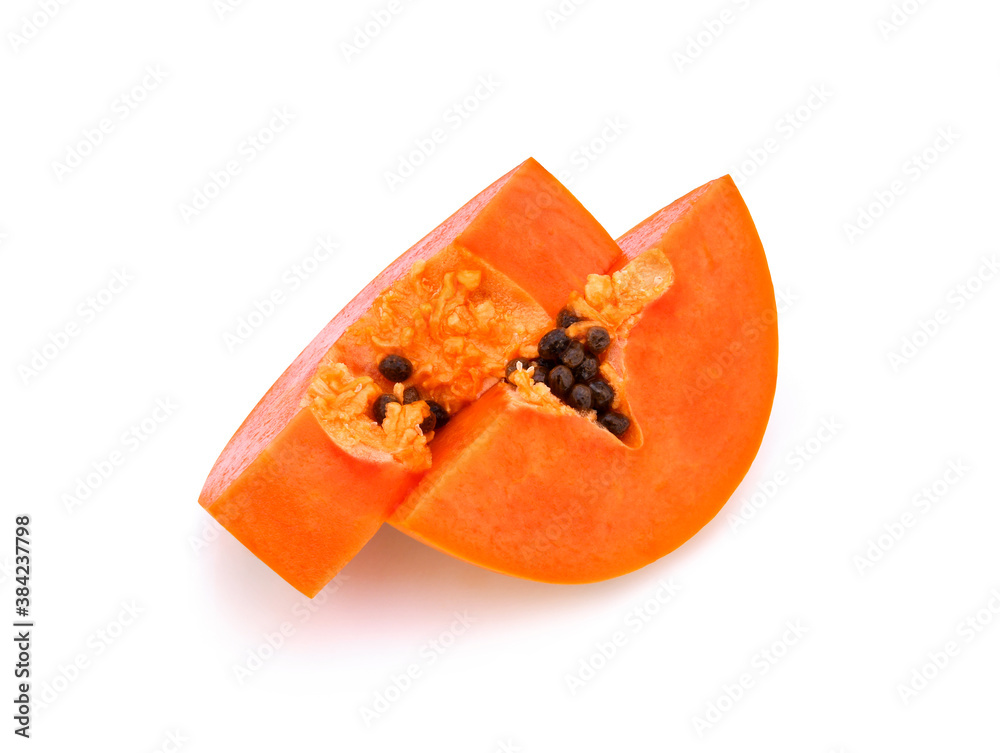 cut ripe papaya with seeds on white background