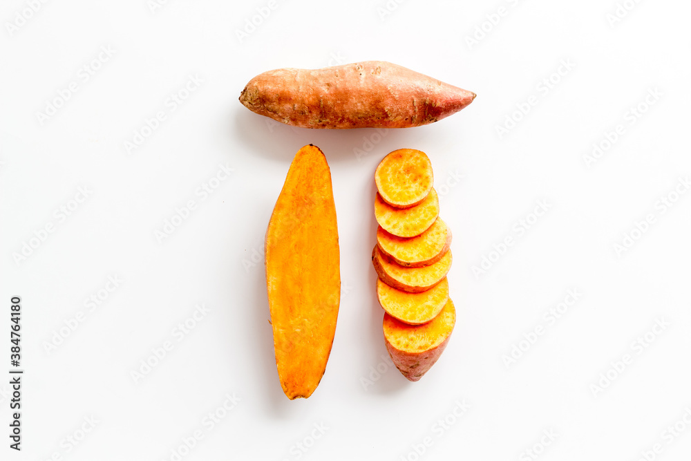 Raw sliced sweet potatoes - organic vegetables, top view