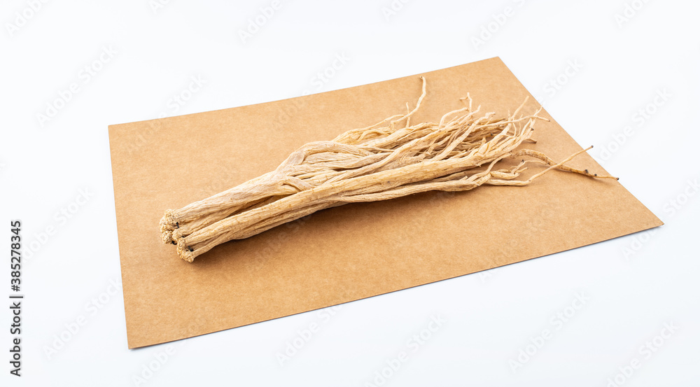 A handful of Chinese herbal medicine Codonopsis on white background
