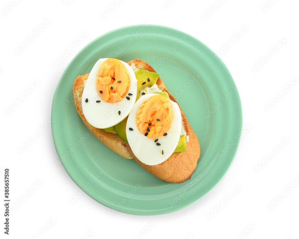 Sandwich with hard boiled egg and avocado against white background