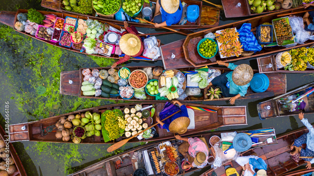 Aerial view famous floating market in Thailand, Damnoen Saduak floating market, Farmer go to sell or