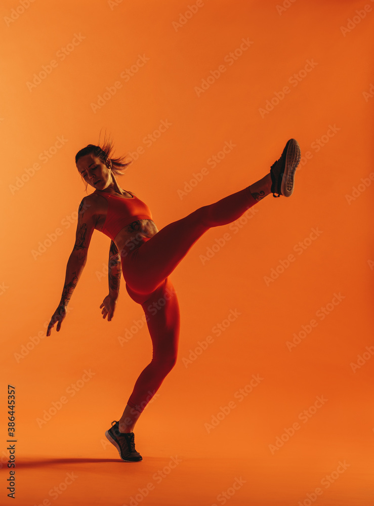 Muscular woman doing fitness exercise
