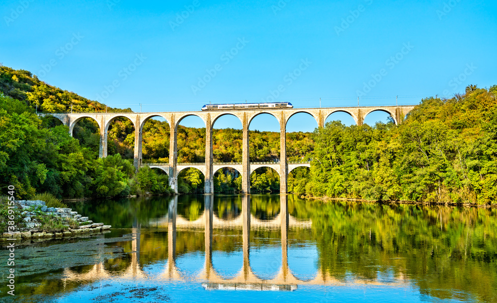 Regional train on the Cize-Bolozon viaduct across the Ain Gorge in France