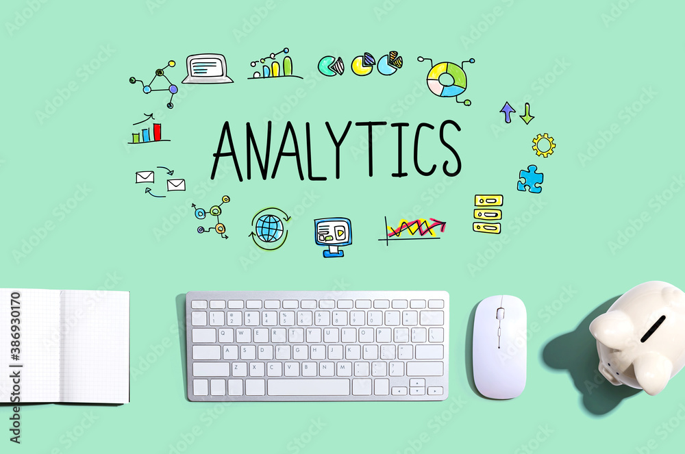 Analytics with a computer keyboard and a piggy bank