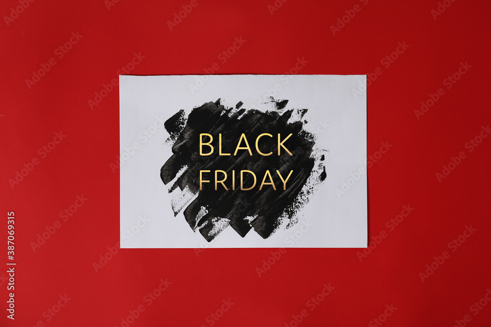Paper sheet with text BLACK FRIDAY on color background