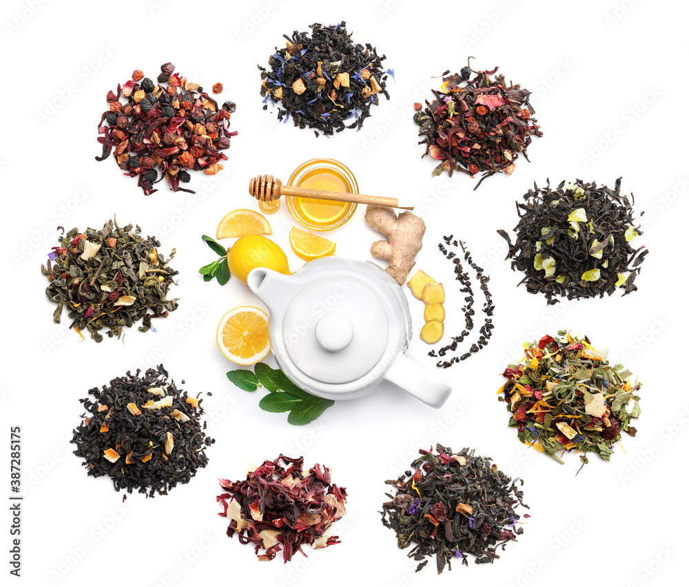 Flat lay composition with teapot, mint, lemon, honey and ginger on white background