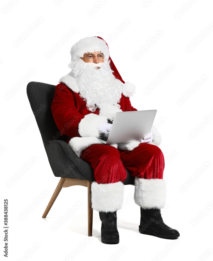 Santa Claus with laptop on white background
