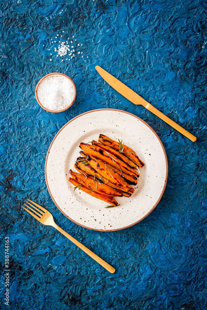 Top view of sweet potato fries with herbs and spices
