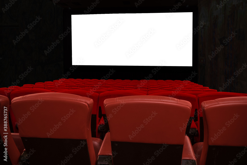 Red seats in theater with white isolated screen