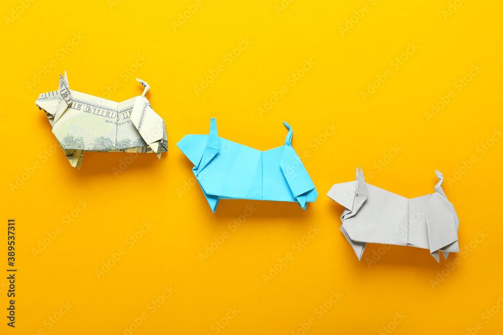 彩色背景上折纸公牛作为2021的象征