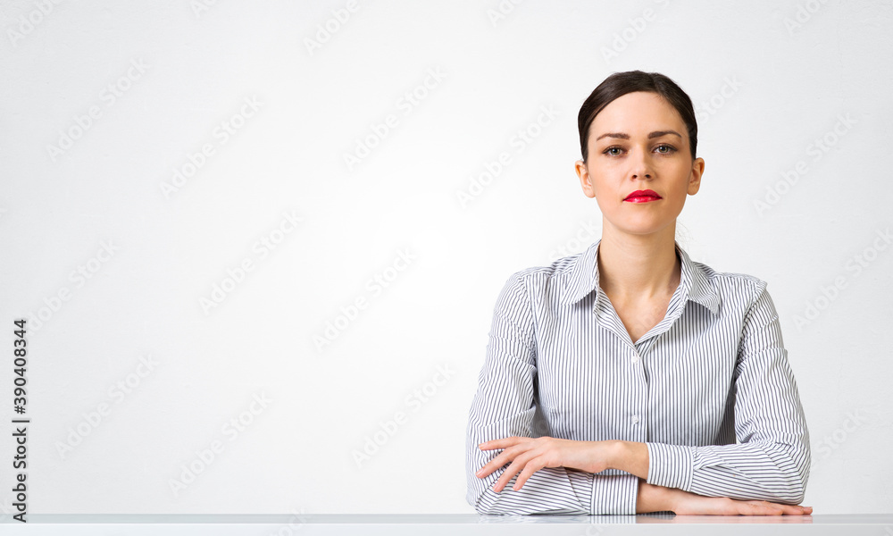 Confident businesswoman sitting at desk