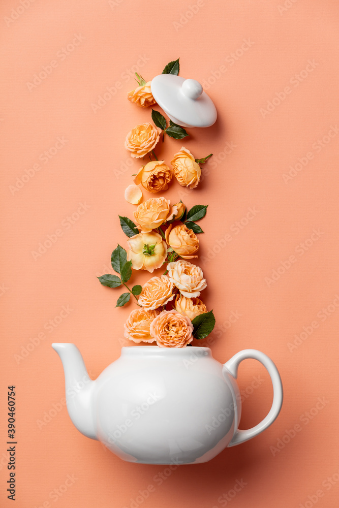 粉色背景橙色玫瑰的whte茶壶创意布局