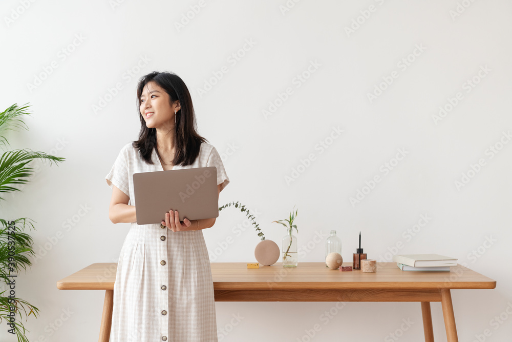 Happy Asian woman working from home