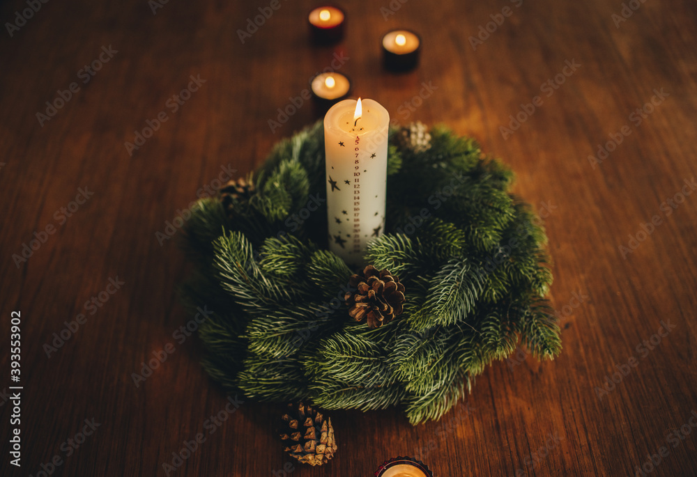 Burning candles with advent wreath