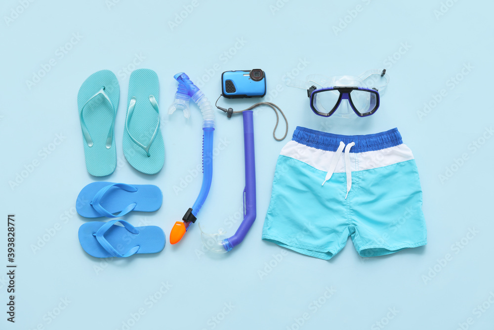 男性海滩配饰，彩色背景带浮潜面罩。家庭度假的概念