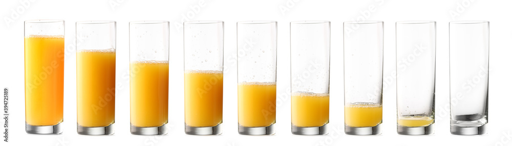 白底不同量橙汁的玻璃杯