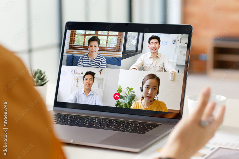 Young Asian businessman work at home and virtual video conference meeting with colleagues business p