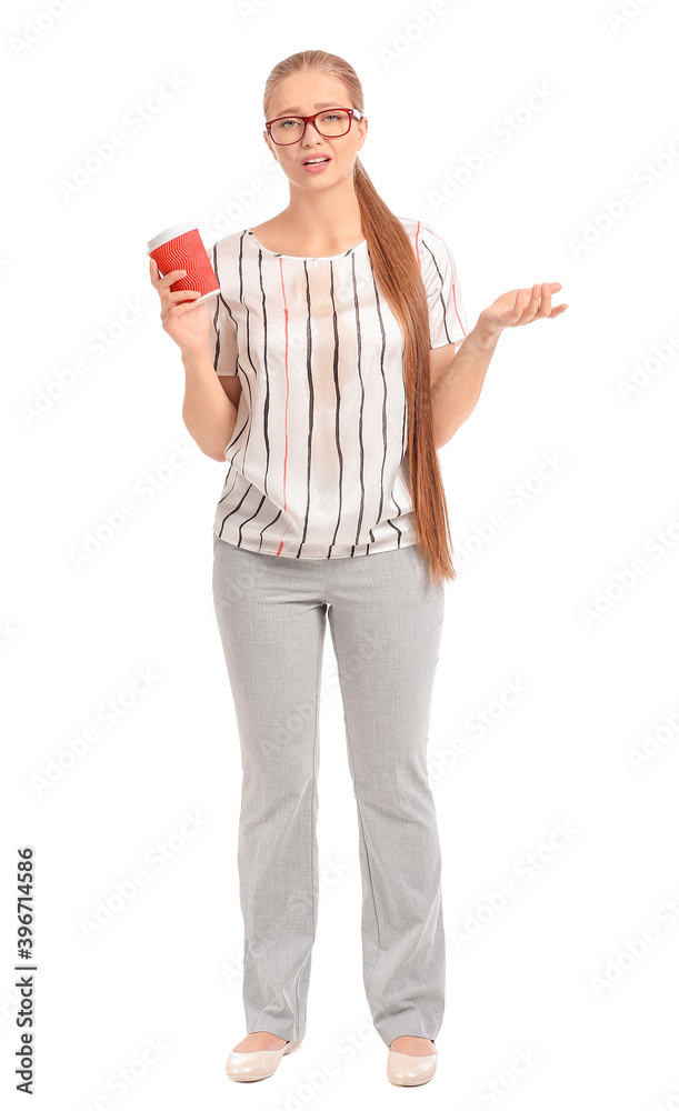 Troubled young woman with coffee stains on her t-shirt on white background