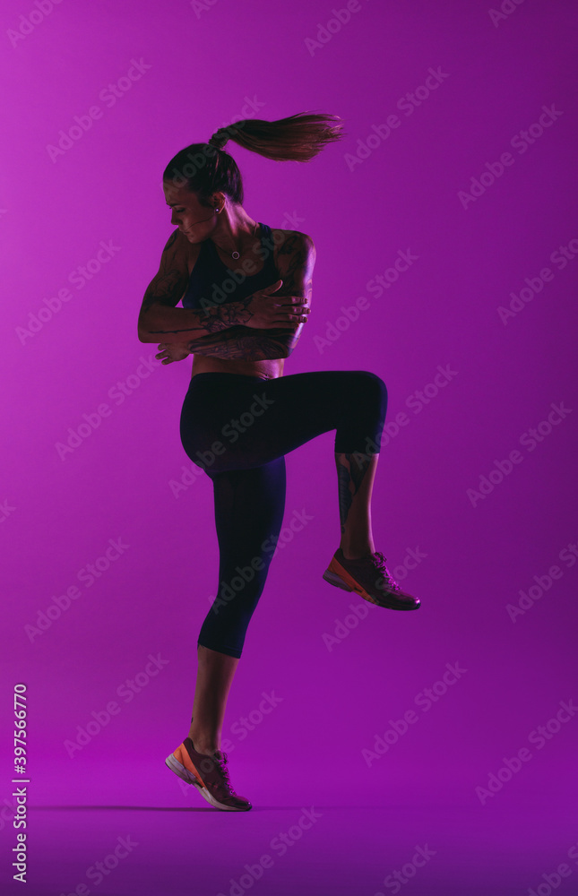 Athletic woman doing aerobic workout