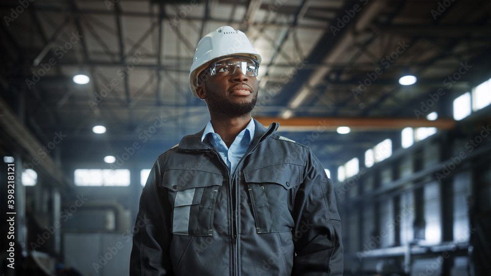Portrait of Professional Heavy Industry Engineer/Worker Wearing Uniform, Glasses, Hard Hat in Steel 