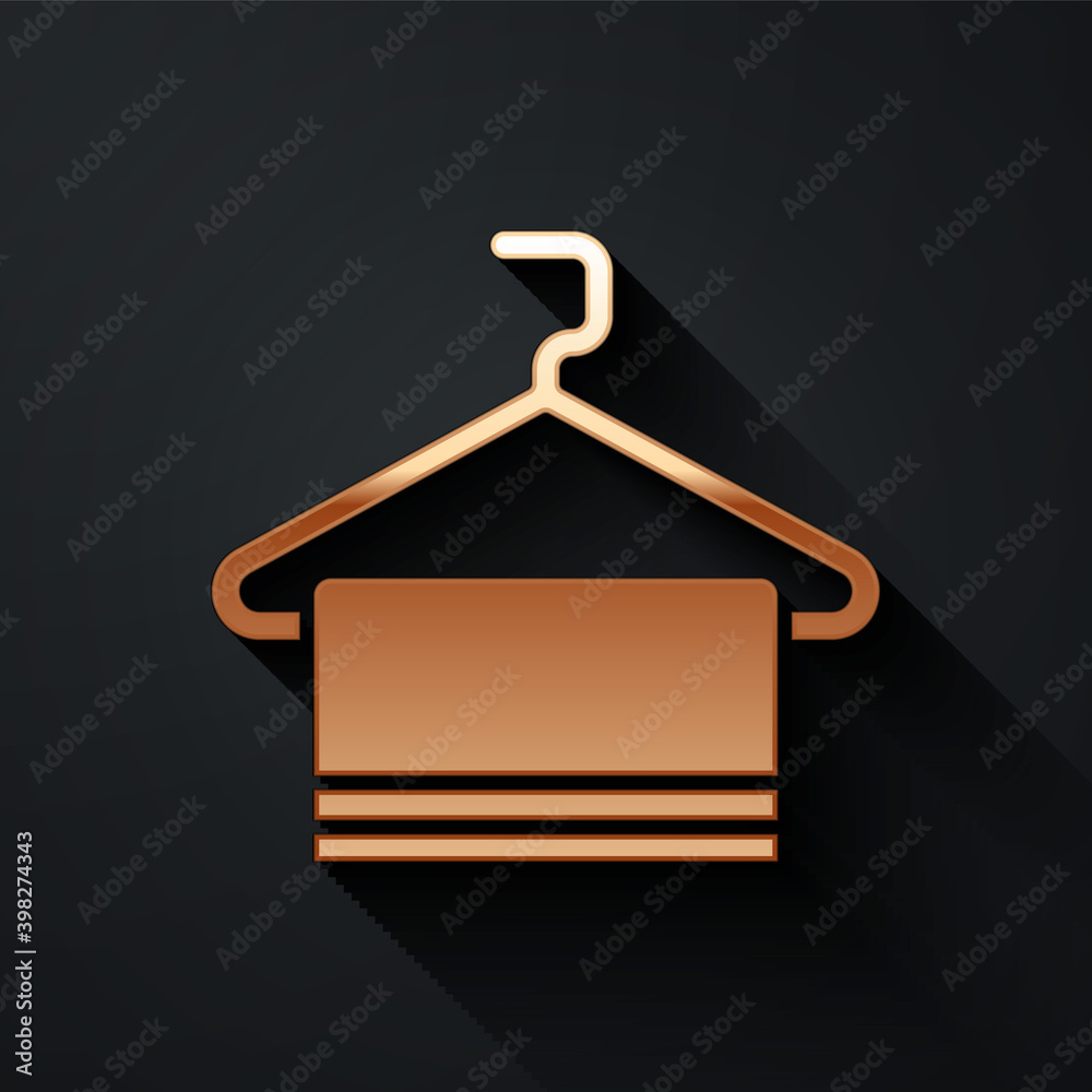 Gold Towel on hanger icon isolated on black background. Bathroom towel icon. Long shadow style. Vect