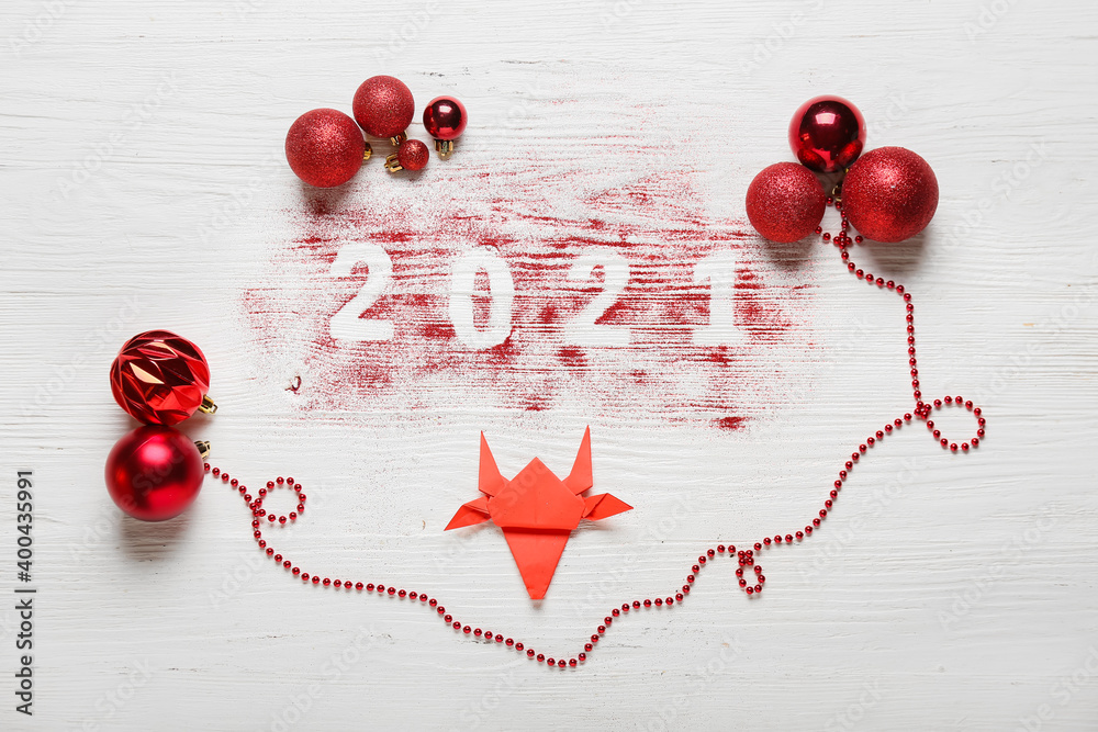 New Year composition with origami bull on white wooden background