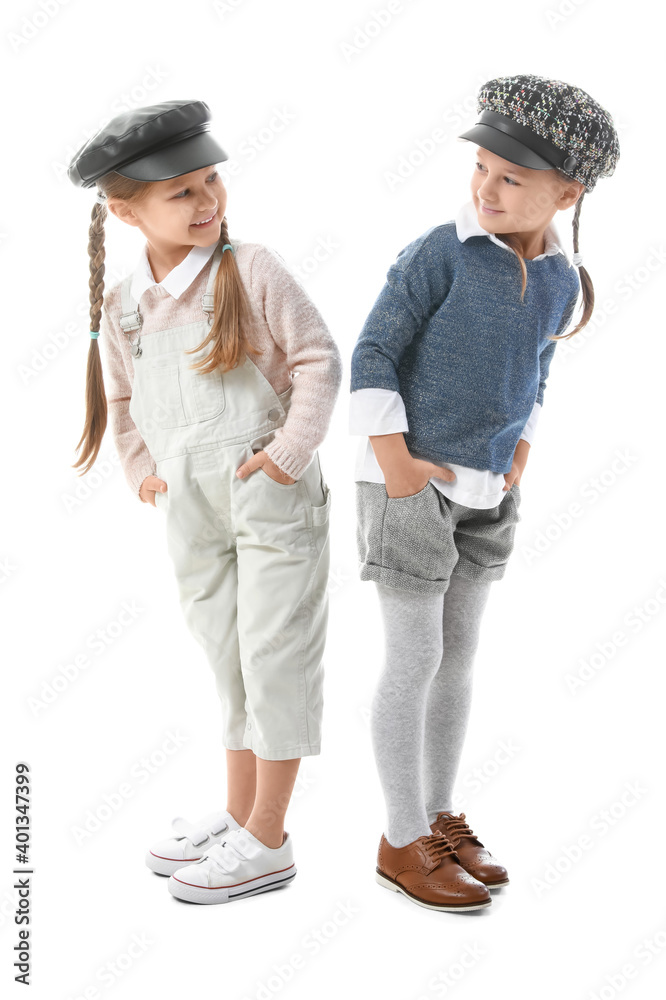 Portrait of stylish little girls on white background