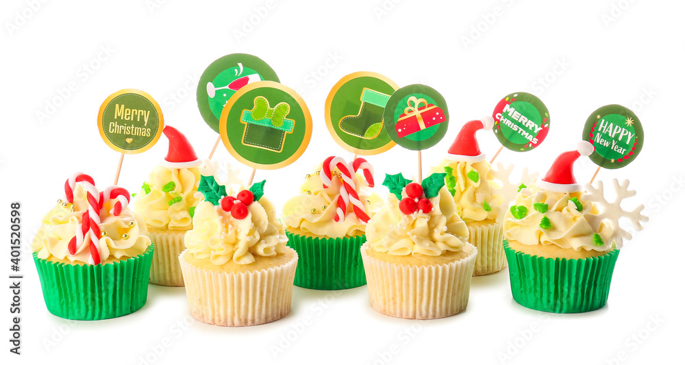 Tasty Christmas cupcakes on white background