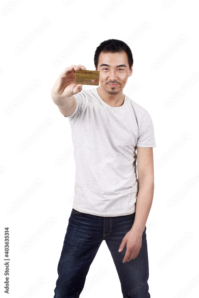 A young business man holding credit card 