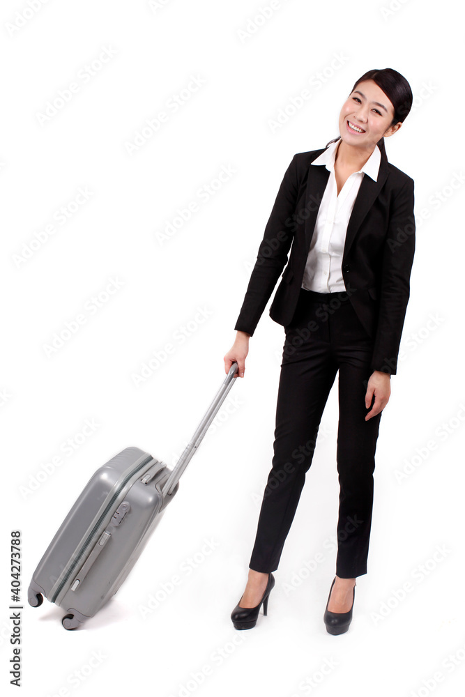 A young Business woman pulling a suitcase 