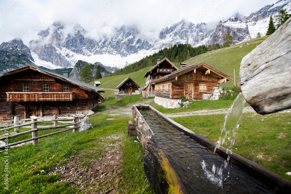 Scenic mountain village with old farmhouses in the Alps