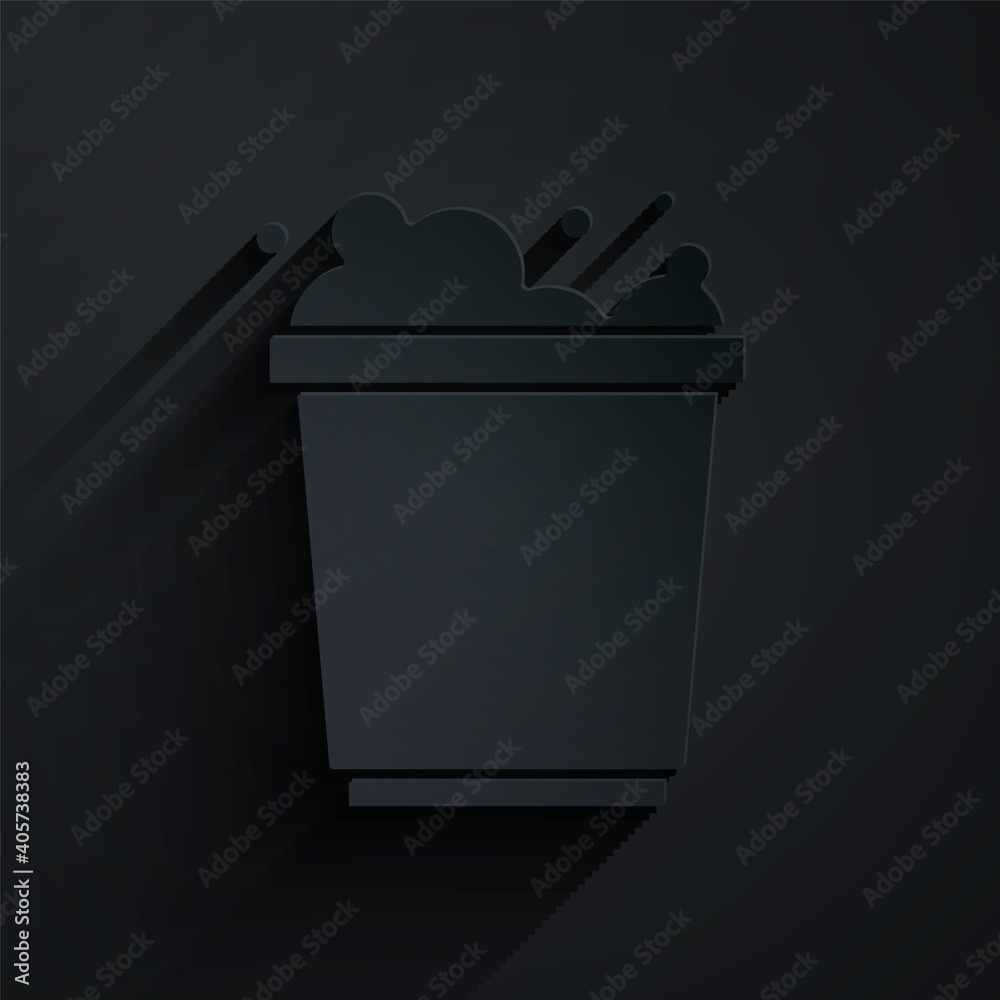 Paper cut Bucket with foam and bubbles icon isolated on black background. Cleaning service concept. 